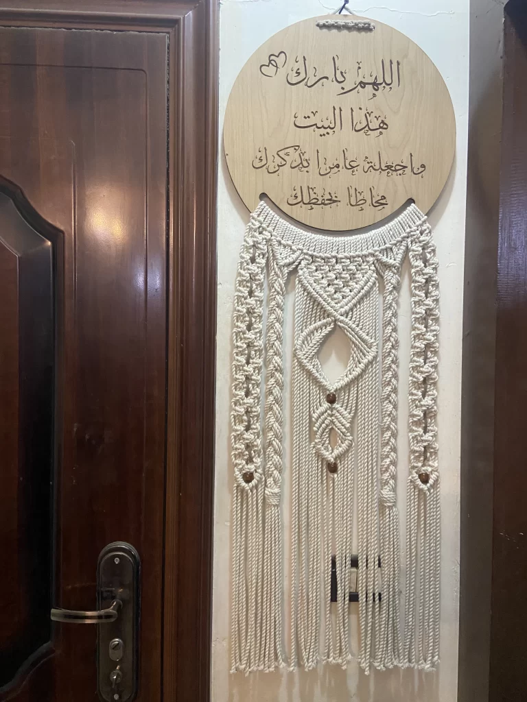 Macrame handmade wall hanging next to door